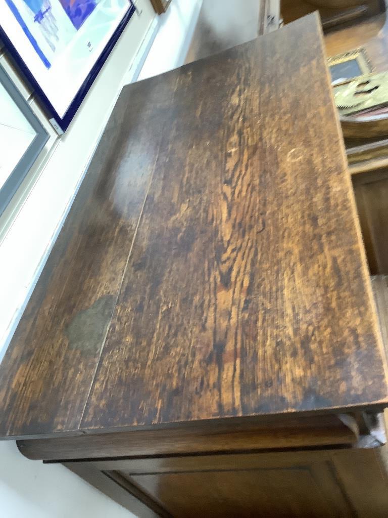 An 18th century oak chest on stand, width 105cm, depth 56cm, height 134cm